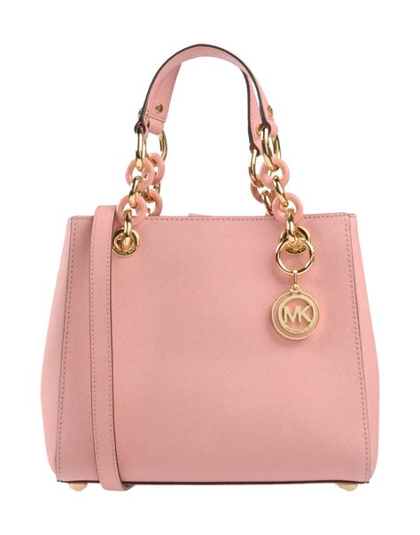 white and pink michael kors purse